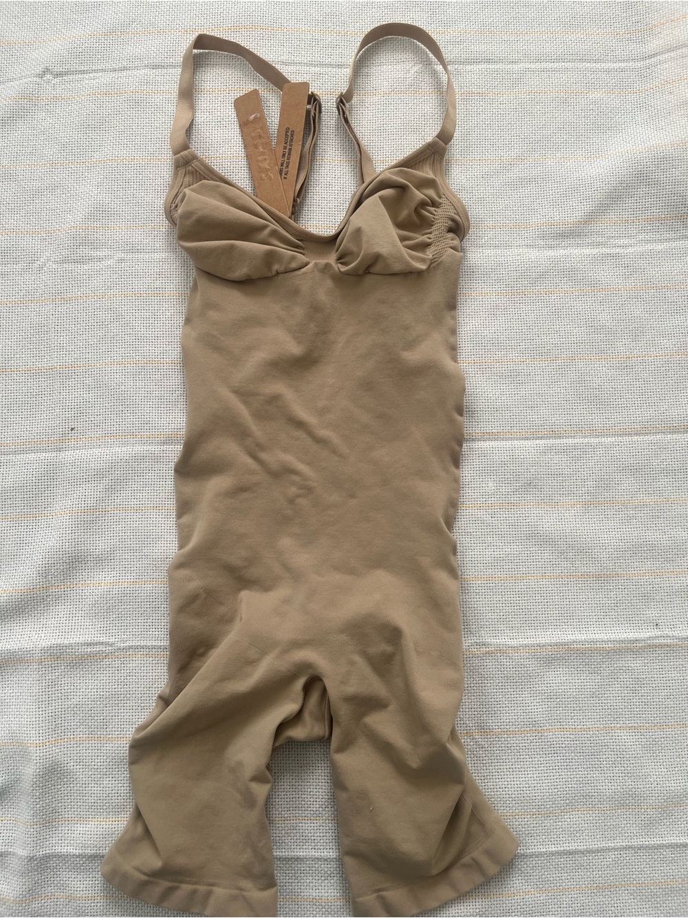 SKIMS Kids One-Piece Bodysuit in Tan